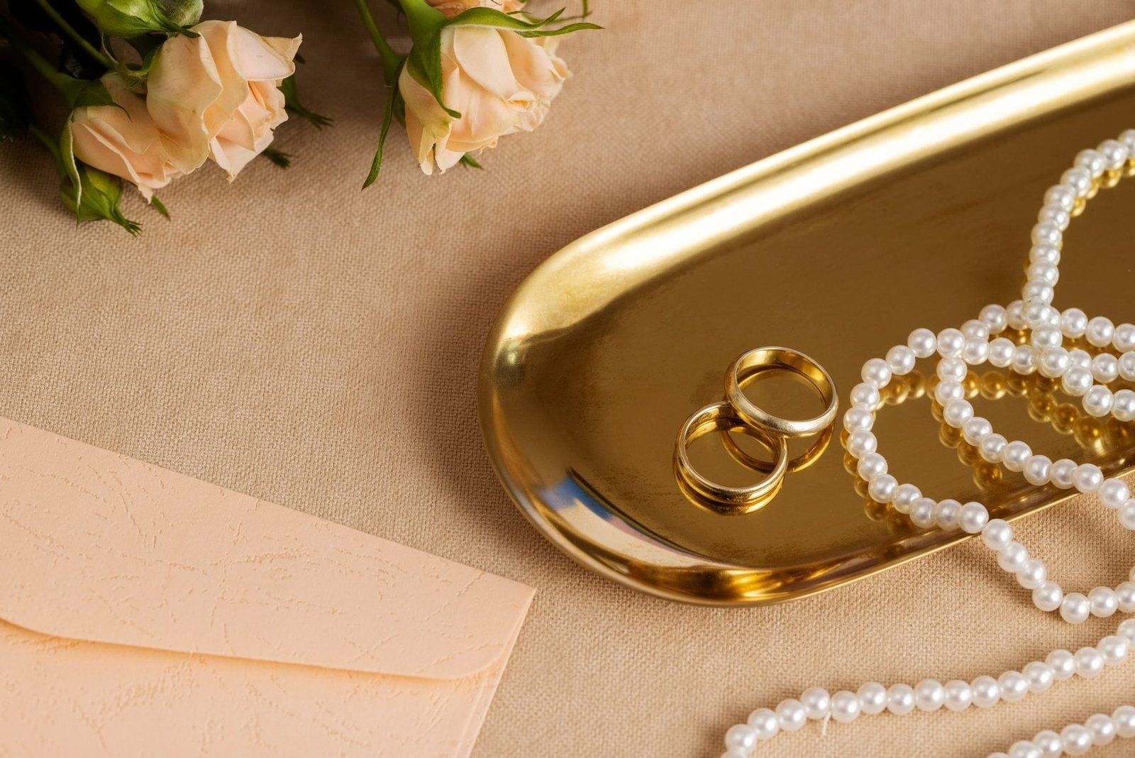 Pearl jewellery on a gold tray